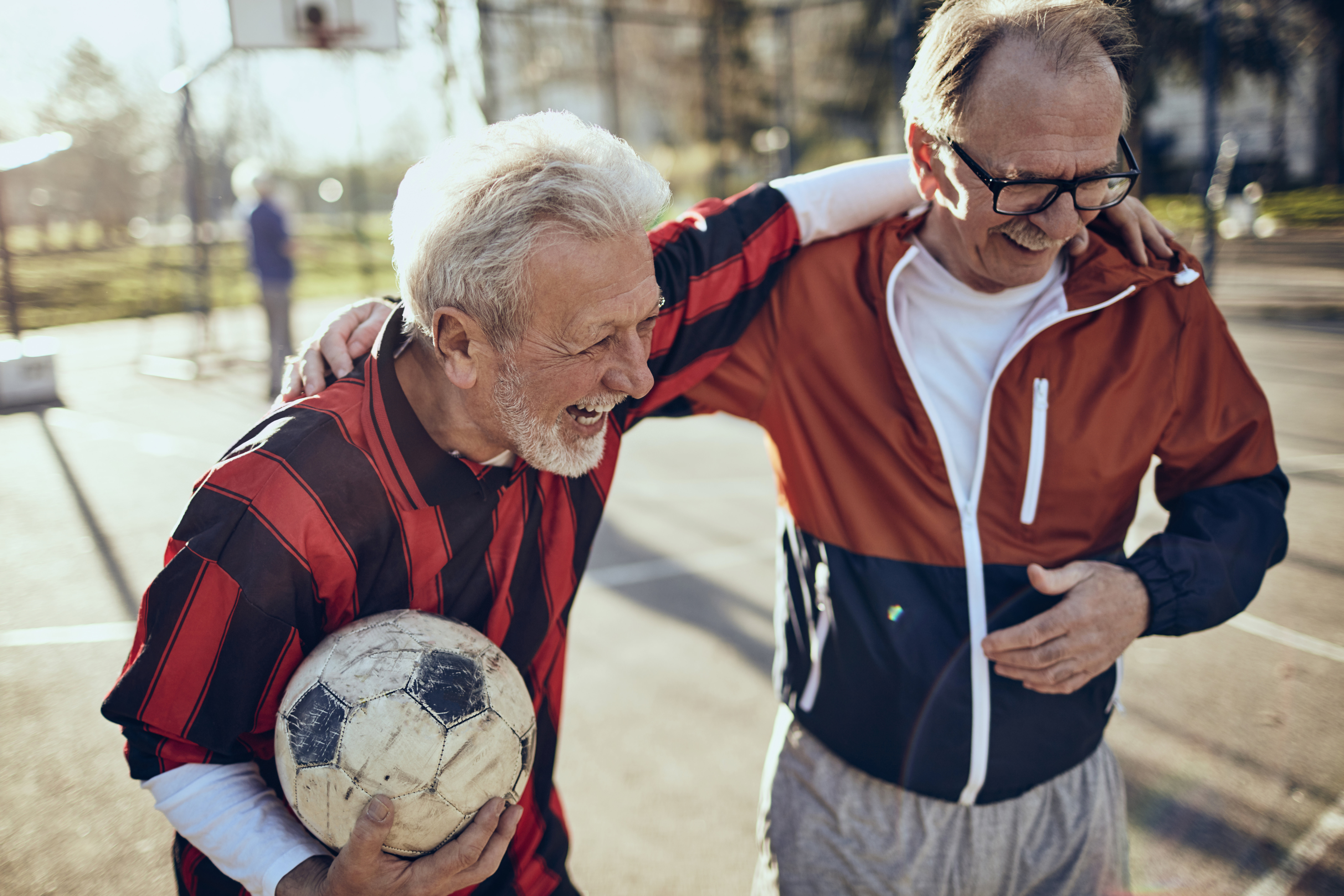 two-men-laughing-with-soccer-ball